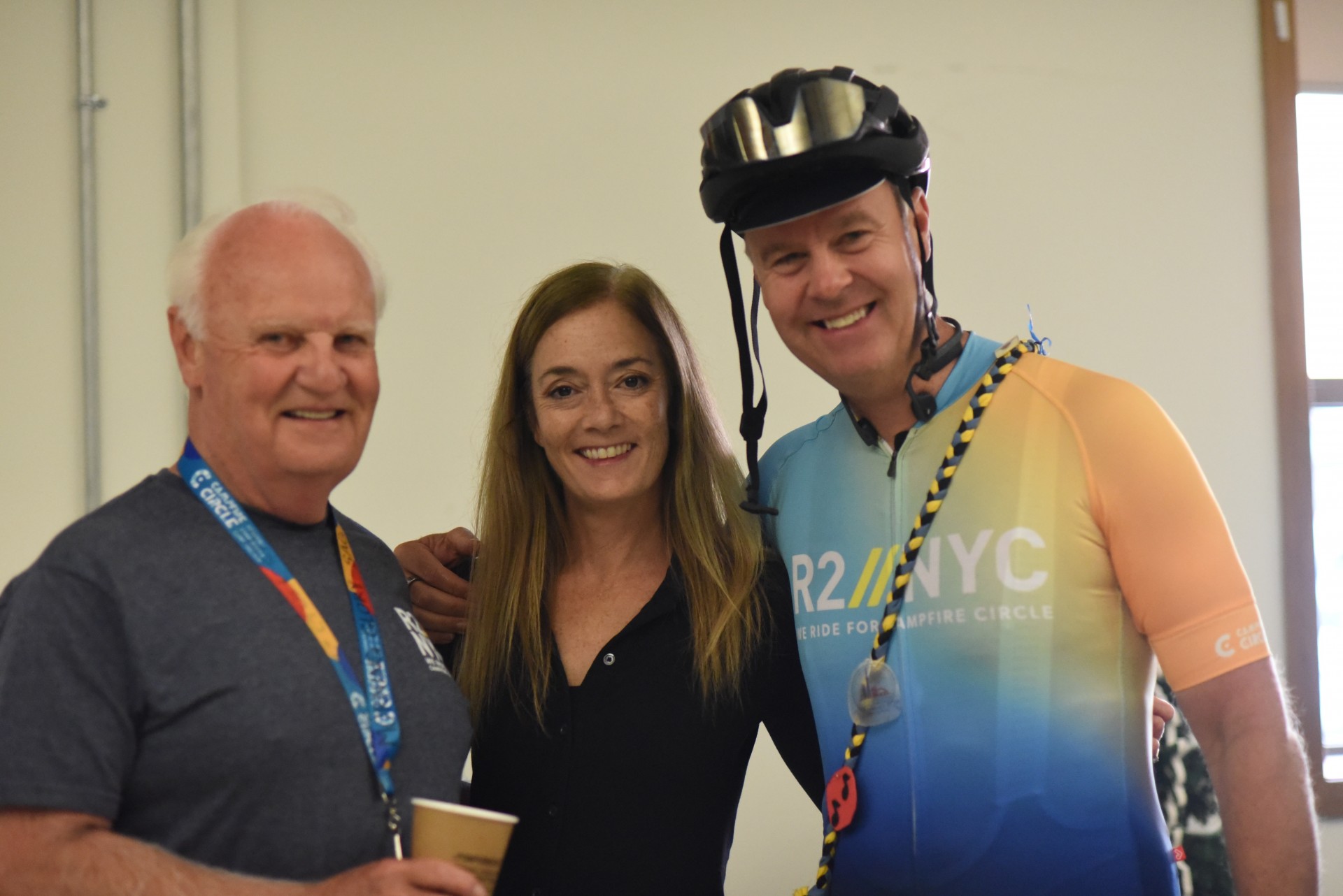 cyclist with two supporters inside at the Campfire Circle Toronto Office