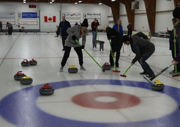 curlers on a curling rink, curling