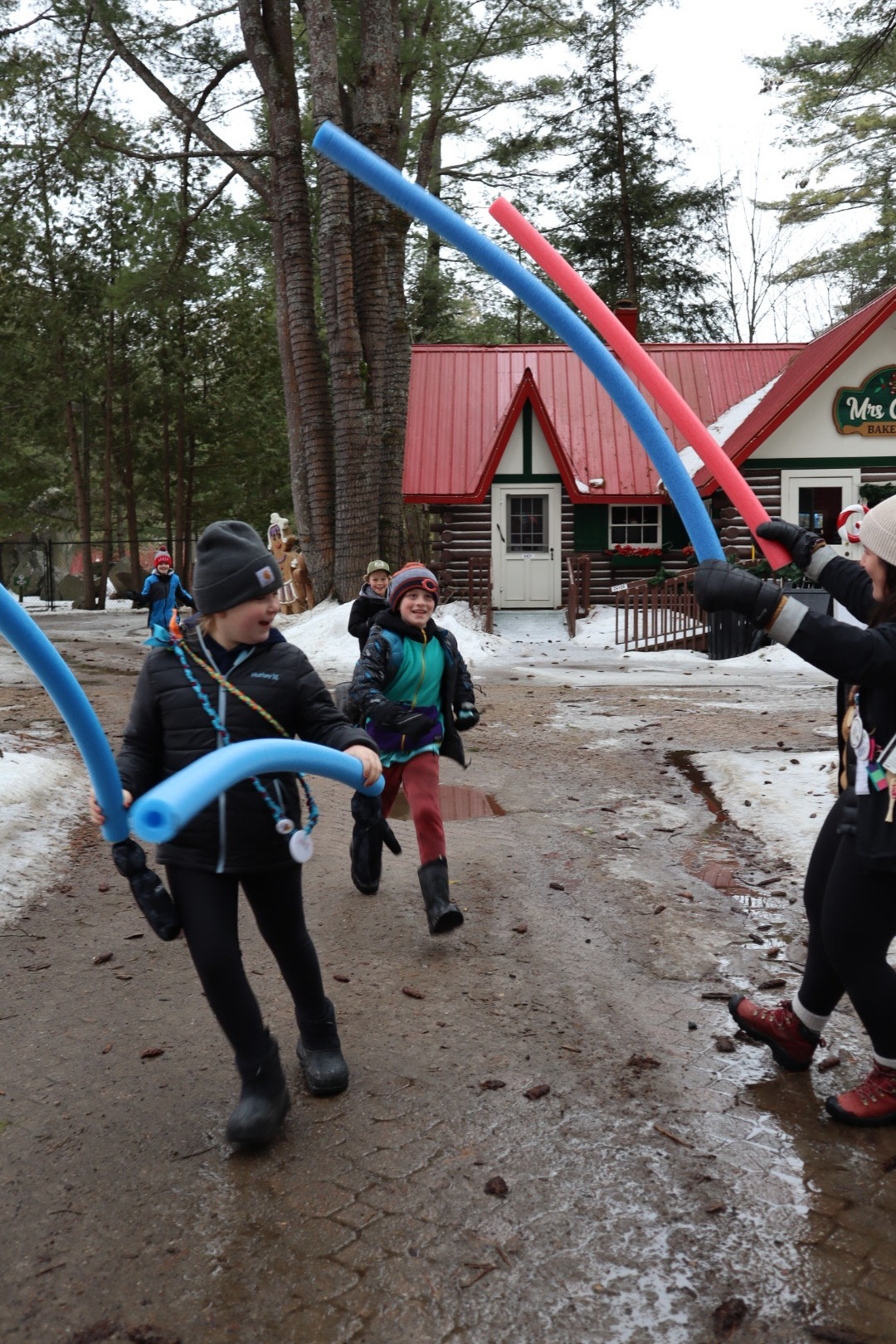 participants having fun with pool noodles