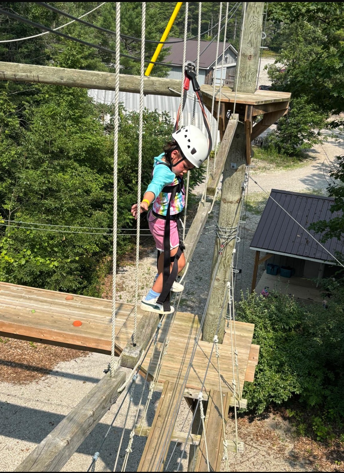 camper on high ropes course
