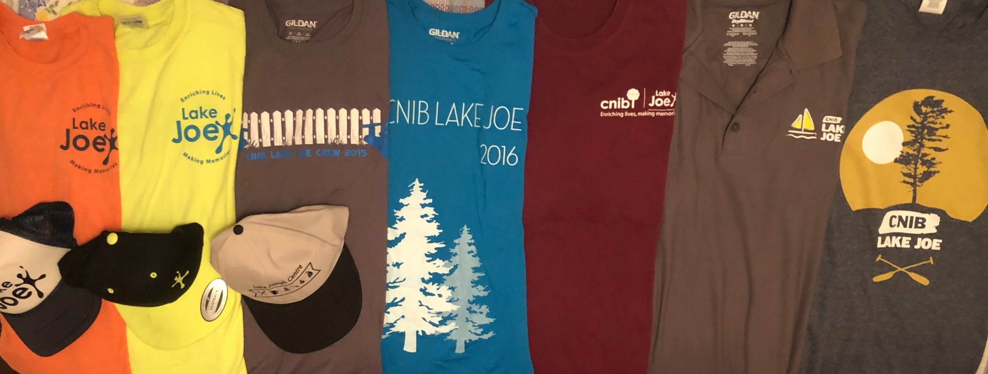 CNIB Lake Joe T-shirts through the years (orange, yellow, brown, blue, red, light grey, and dark grey)
